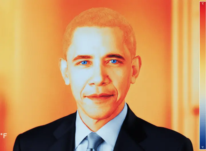 A thermal camera image, hot suit, cold pale face.